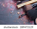 make up set, soft  makeup  brushes and  maskara on black background