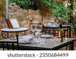 Al fresco tables waiting for customers at an outdoor restaurant in the medieval town of Saint Paul de Vence, French Riviera, South of France