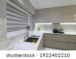 Luxury large modern white marble kitchen united with dining room