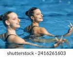 Synchronized swimming as a dynamic duet brings fluid artistry to the pool, graceful movements and synchronized precision  