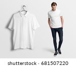 White polo on a man in jeans, isolated mockup. Hanging blank polo, t-shirt against empty wall.