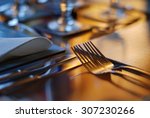 Table set for fine dining with cutlery and glassware