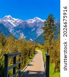 Small wooden bridge. On the way to Lake Matheson. Mount Cook and Mount Tasman. Magnificent journey to distant lands. New Zealand, South Island