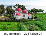 Small photo of Greek Orthodox monastery of the Twelve Apostles in Capernaum. Tropical park around the Church