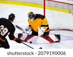 Small photo of Ice Hockey Goalie breakaway save