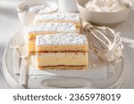 Sweet napoleon cake made of layer with custard cream. Kremowka cake with custard cream.