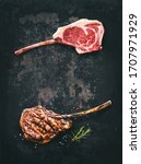 Small photo of Black angus Tomahawk beef steaks raw and grilled with seasoning on dark rustic background