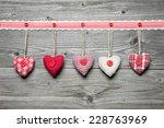 Red hearts hanging over old wood background. Valentines Day Background