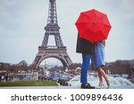 romantic holidays for couple in Paris, honeymoon vacation in France, Europe, man and woman kissing near Eiffel tower