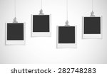 blank photo frame hanging on a... | Shutterstock .eps vector #282748283