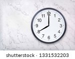 Small photo of Wall clock show eight o'clock on white marble texture. Office clock show 8pm or 8am on marble background