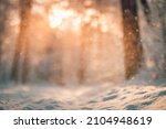 Small photo of Abstract closeup winter nature, snowing against sunset light defocused background. Selective focus shallow depth of field. Dream inspire frozen winter forest ground. Bokeh tress and calm nature view