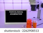 Small photo of Medical tests and diagnostic procedures concept. Text on display in lab Toxicological Examination