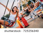 Two friends at amusement park. Soft focus, high ISO, grainy image.