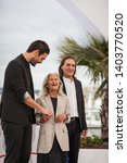 Small photo of CANNES, FRANCE - MAY 21, 2019: Amador Arias Mon, Benedicta Sanchez Vila and Director Oliver Laxe attend the photocall for "Viendra Le Feu" during the 72nd annual Cannes Film Festival