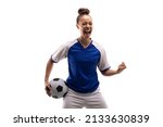 Small photo of Biracial young female player shouting while standing with clenched fist and soccer ball. white background, unaltered, sport, sports uniform, copy space, victory, athlete and women's soccer.
