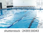 A lone swimmer practices in an...