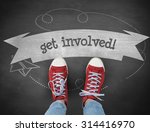 Small photo of The word get involved! and casual shoes against black background