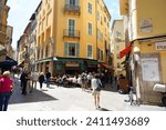 Small photo of Nice, France - April 25, 2023: An old town with a variety of outdoor cafes and restaurants, shops and houses set in narrow alleyways that are usually eagerly visited by many people.
