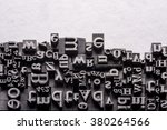 Metal Letterpress Types. A background from many historic typographical letters in black and white with white background. 