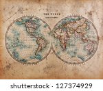 A genuine old stained World map dated from the mid 1800's showing Western and Eastern Hemispheres with hand colouring.