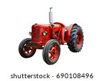 Vintage red tractor, isolated on white background.