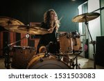 Woman Playing Drums During...