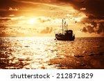 Fisherman's Boat In A Sea