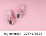 Pink child shoes on pink background. Children's shoes for girls