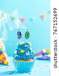 Small photo of Ninetieth 90th birthday cupcake with candle blow up and sprinkles. Card mockup.