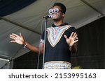 Small photo of New Orleans, LA USA - Latin music star Cimafunk performs his afro cuban funk at the 2022 New Orleans Jazz and Heritage Festival.
