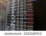 Small photo of Orlando, Florida - June 26, 2023 - An arrival and departure board at Orlando International Airport shows delayed and cancelled flights.
