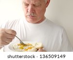 Older Man Eating His Breakfast