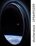 Small photo of View on ISS Progress resupply ship, View out from a passenger window on the SpaceX Crew Dragon. Docking maneuver near the Space Station. Elements of image furnished by NASA