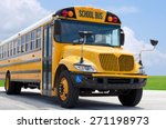 School Bus On Blacktop With...