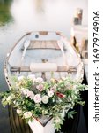 Flowers On White Rowboat ...