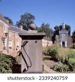 Small photo of BREDA, HOLLAND - AUGUST 19 2019: Houses and church of the Begijnhof, a walled place of a former semi-monastic Christian lay order. The Beguines were active in 13-16th century