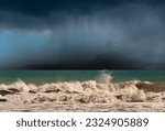 Rough sea with storm clouds (cumulonimbus) and torrential rain. Mediterranean sea (Ligurian sea), Gulf of La Spezia, Liguria, Italy, Europe.