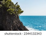 Rocky coast with cliffs and seascape (Mediterranean sea - Ligurian sea) between the small village of Framura and Bonassola, Cinque Terre, La Spezia province, Liguria, Italy, southern Europe. 