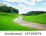panoramic view of nice green hill and path  on blue sky background