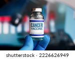 Small photo of Experimental cancer vaccine vial for immunization against Cancer disease. Doctor with vial of the Cancer vaccine