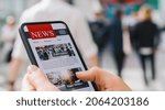 Small photo of Online news on a mobile phone. Close up of businesswoman reading news or articles in a smartphone screen application. Hand holding smart device. Mockup website. Newspaper and portal on internet.
