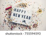 Happy New year displayed on a vintage lightbox with decoration for New Year's Eve, concept image