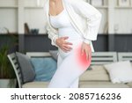 Hip pain  woman suffering from...