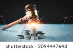 Small photo of Old wood Judge hammer with stacking coins in close-up and coins stack the table wood background, Used for adjudication and Justice.
