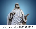 A Statue Of Jesus With Open...