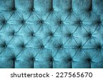 close up of a turquoise velvet sofa