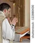 Small photo of catholic priest at tridentine mass