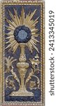 Small photo of VARALLO, ITALY - JULY 17, 2022: The monstrance carved polychrome relief on the tabernacle in the church Basilica del Sacro Monte by unknown artist.