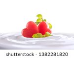 Plain yogurt with fresh heart shape watermelon on top in bowl isolated on white background
